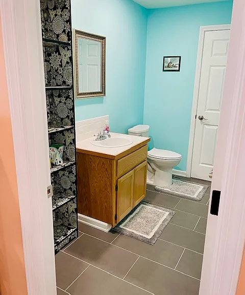 Guest bathroom connects to the living room.