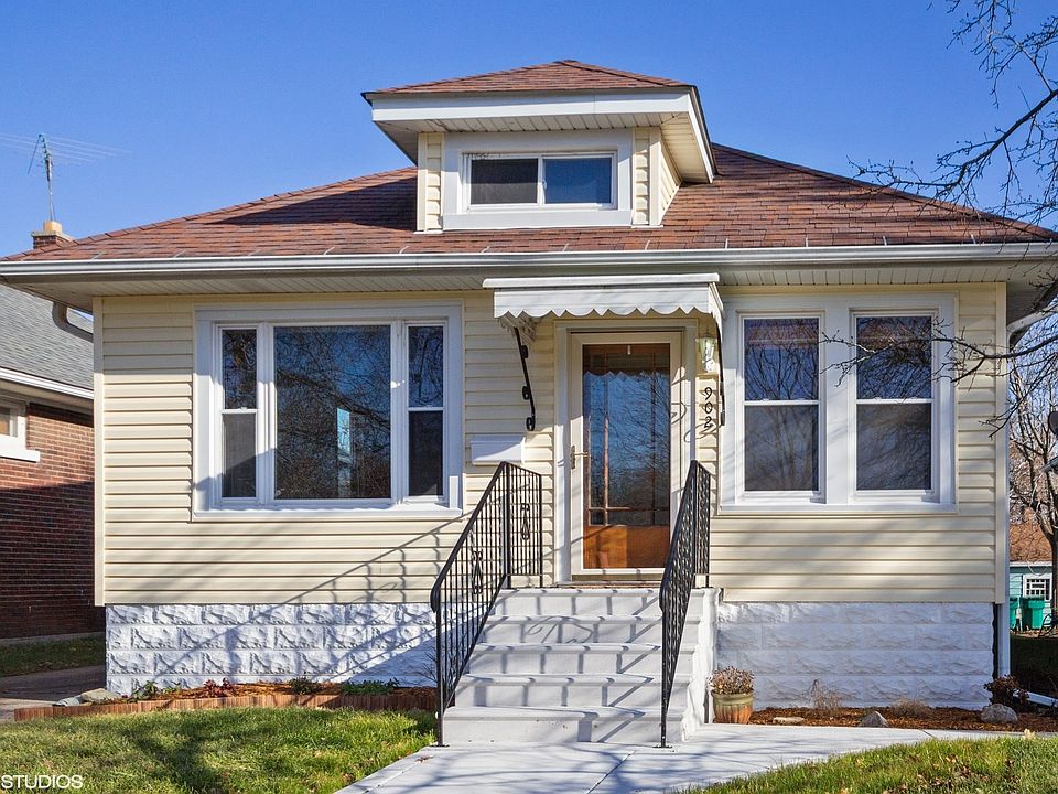 Front elevation. Brand new Steps, railings and sidewalk. Newer siding.