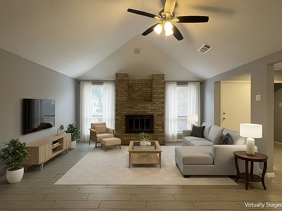 View of the living room looking towards the entry door to the right of the window.