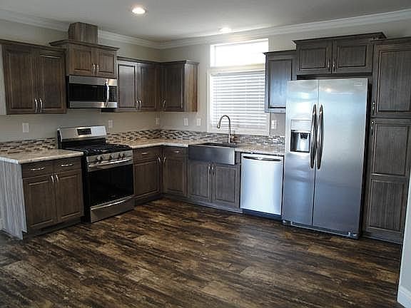 Stainless appliances. Gas range, microwave, dishwasher, side-by-side refrigerator, farm sink and garbage disposal.
