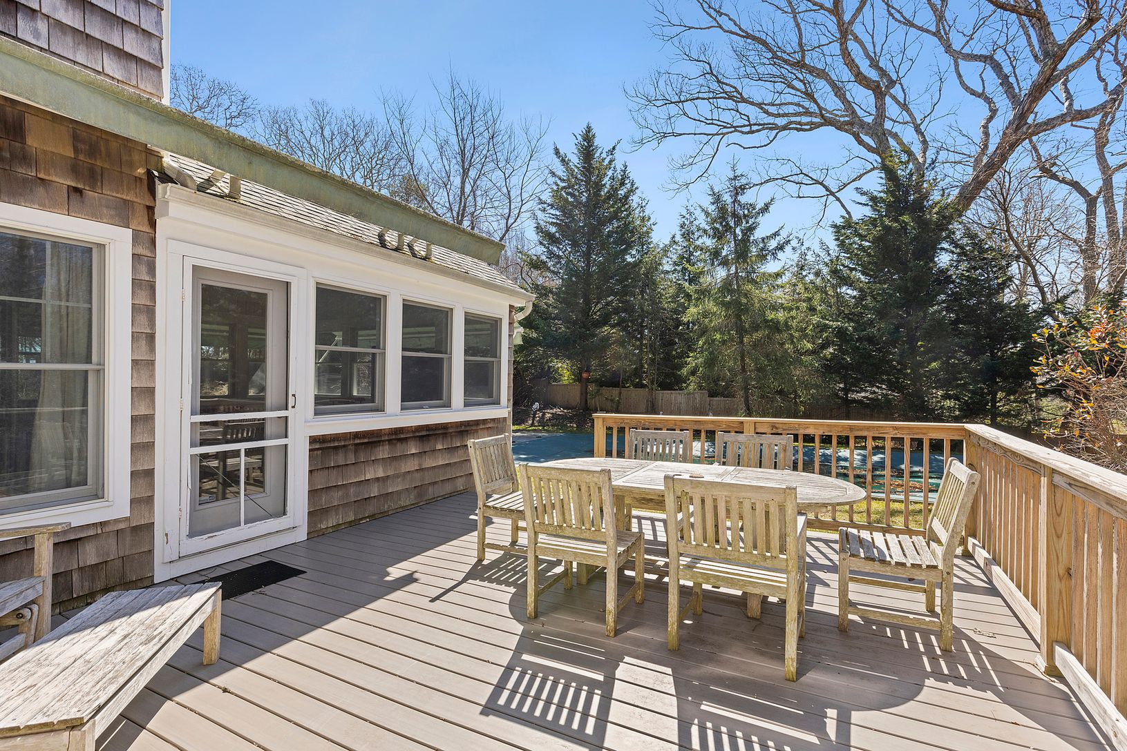 Porch overlooking solar heated pool