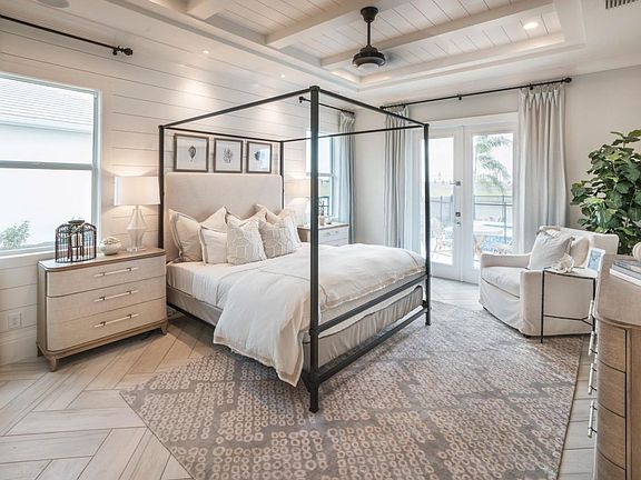 Expansive primary bedroom suite with access to rear lanai