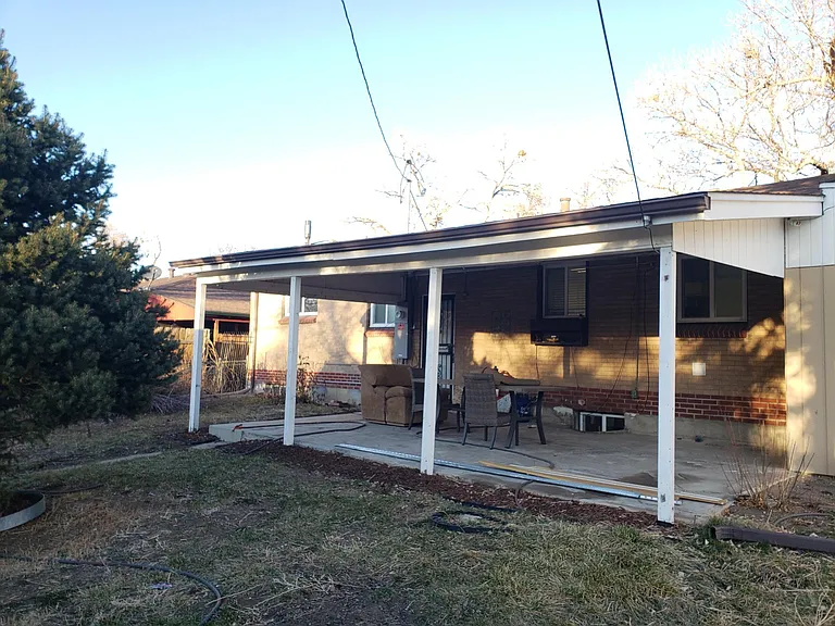 Large Covered Back Patio with New Dining Table and Chairs