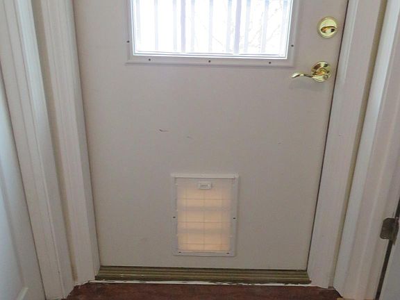 "Doggie/Kitty Door. Bathroom to the right on first level.