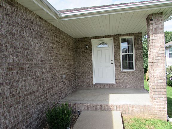 Entry with large front covered patio.