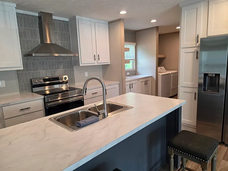Loads of kitchen storage. Easy to maneuver around kitchen. Dishwasher not pictured but is included beside the sink!