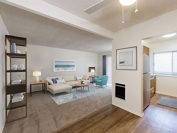Renovated I kitchen and dining area with hard surface flooring and carpeted living area