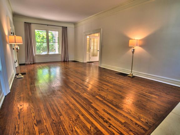 Spacious living room with real wood fireplace