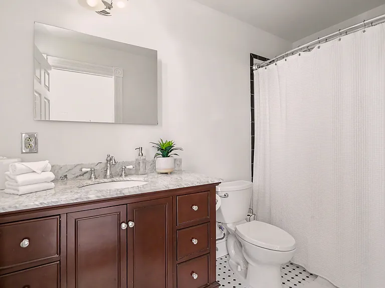 Primary bathroom with tub and shower
