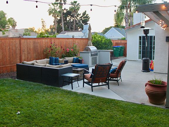 Back patio with built-in grill and firepit.