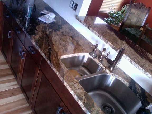 supreme solid granite. Custom Kraftmaid cabinets w/ self closing drawers