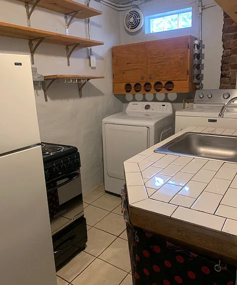 Kitchen (includes refrigerator/freezer, oven/stove, dishwasher, and washer/dryer)