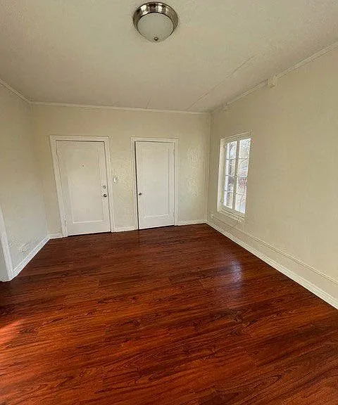 Beautiful hardwood flooring in living room at Molino Del Mar Apartments in Pasadena, California.