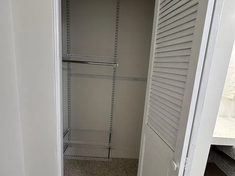Two Closets with lights and shelves