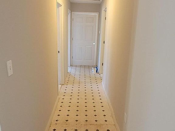 Hallway to the massive back bedrooms