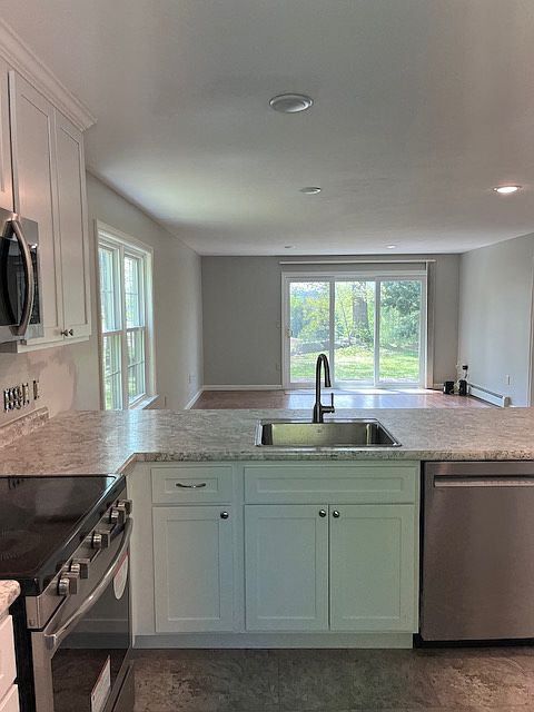 kitchen looks into dining/living area