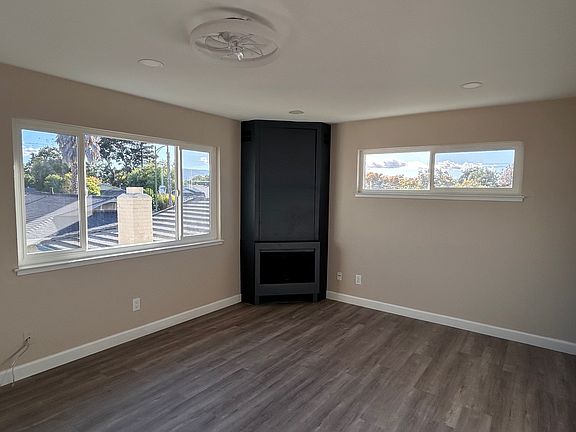 Living Room with recessed lights and a ceiling fan