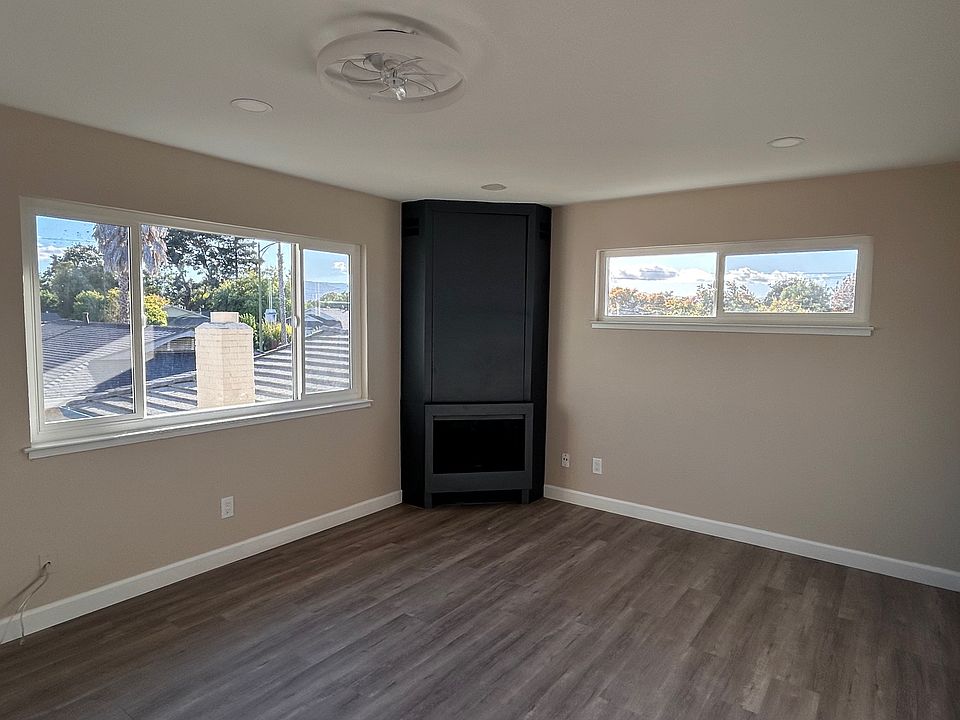 Living Room with recessed lights and a ceiling fan