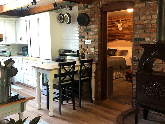 Room off kitchen, makes a great family room, office or bedroom. Has a French door to an outside patio with a view to the side yard
There is a decorative woodstove i the kitchen dining area, but it is not for use.