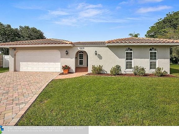 Newly painted home with pavers, front double door courtyard and newer roof and windows...