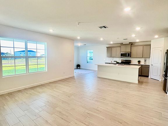 family room views of mile long lake and greenspace as well as u pic farm!