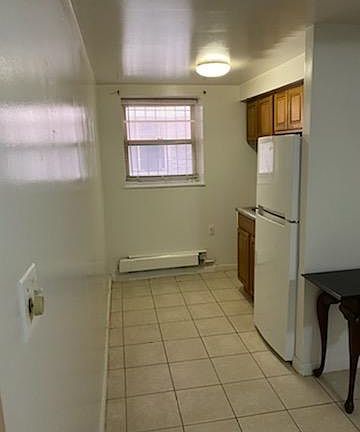 Kitchen to the right of the living room