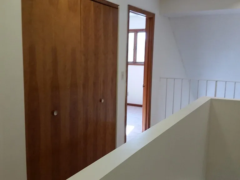 Upstairs laundry closet, second bedroom, living room overlook