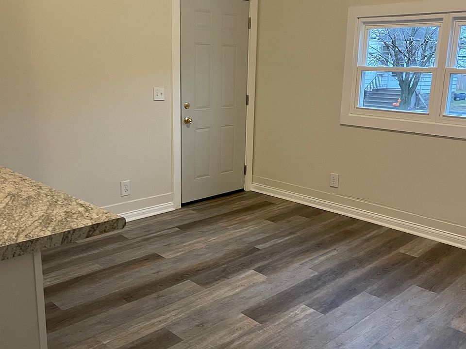 Living room freshly painted, new wood flooring , new windows. Open concept kitchen with extended area for bar stools