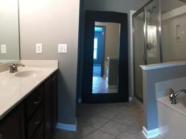En suite in primary bedroom.

double vanity, stand up shower and soaker tub.