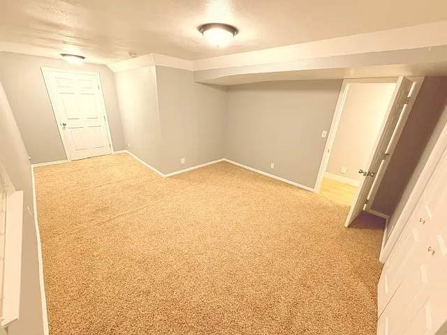 Main room w/ door access to private laundry room.