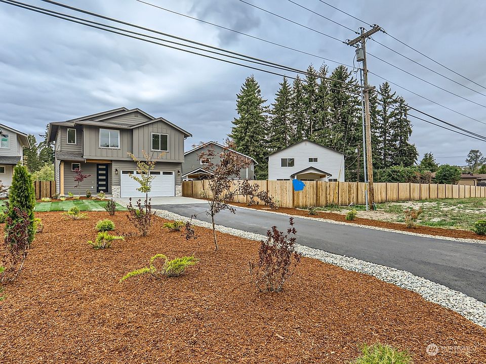 Exterior Front with amazing landscaping.>