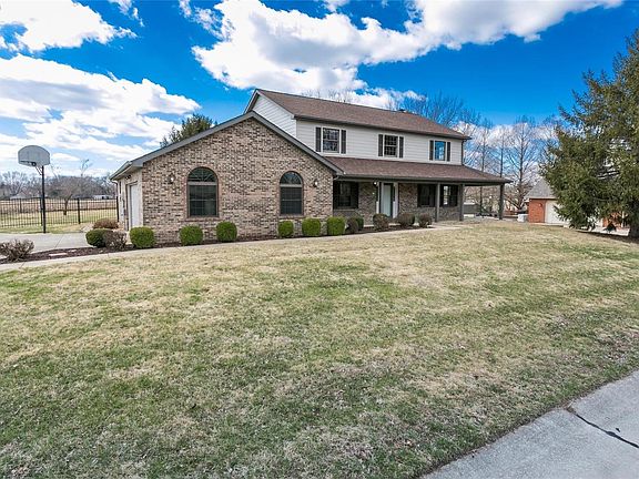 2 car oversized side entry garage with new windows. The interior of the garage is also drywalled and painted. Notice that the ya