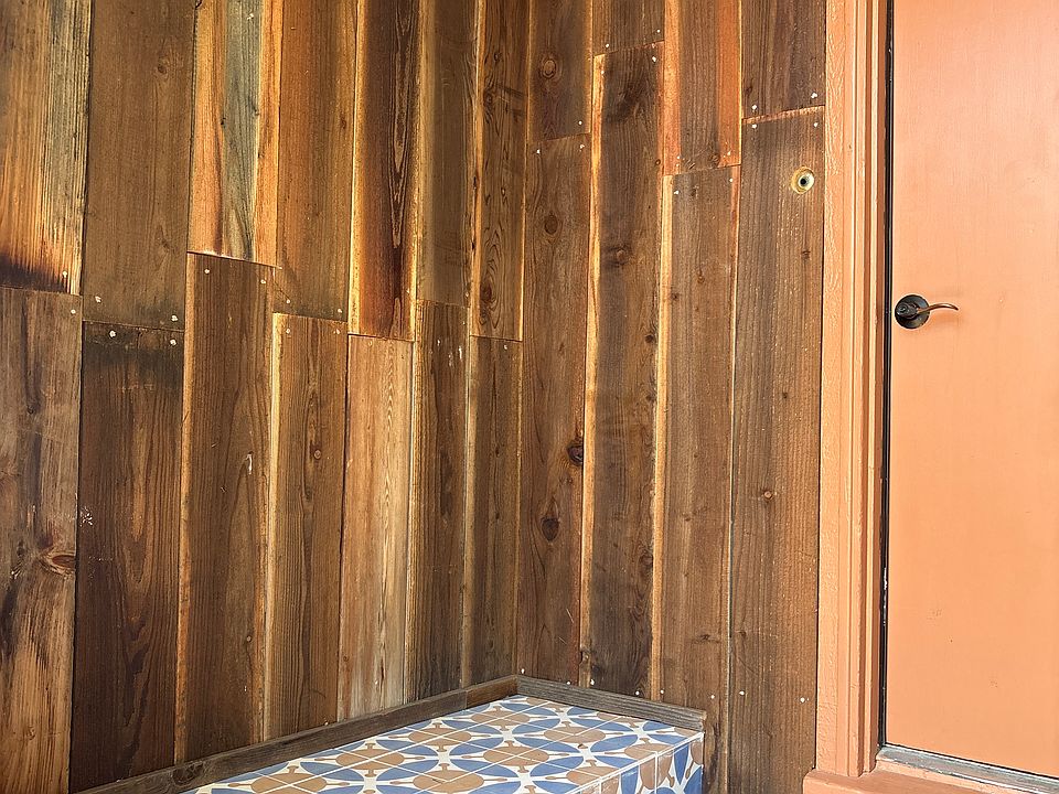 Entrance of the house. Beautiful tile bench.