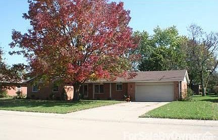 2-car attached garage with mature trees