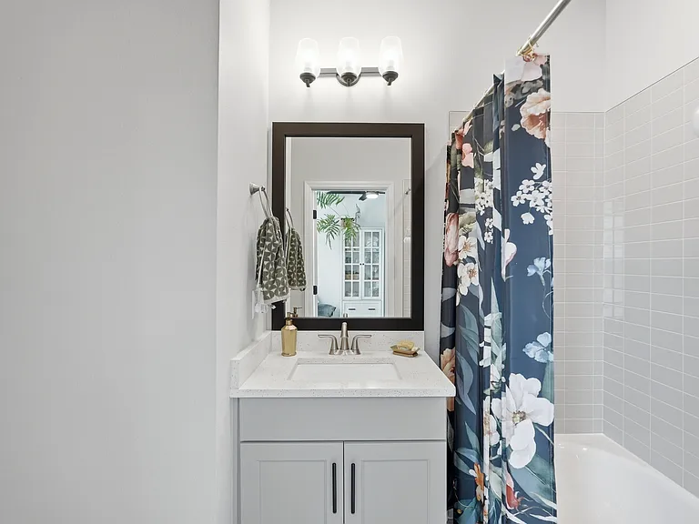 2nd bedroom's ensuite bathroom with tub.