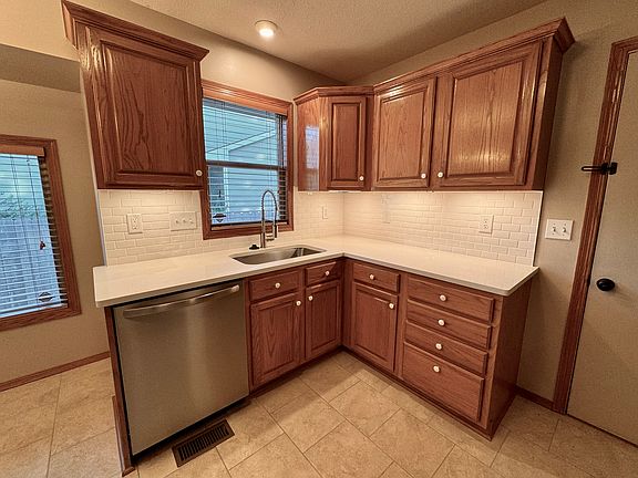 Kitchen with new countertops, sink and faucet