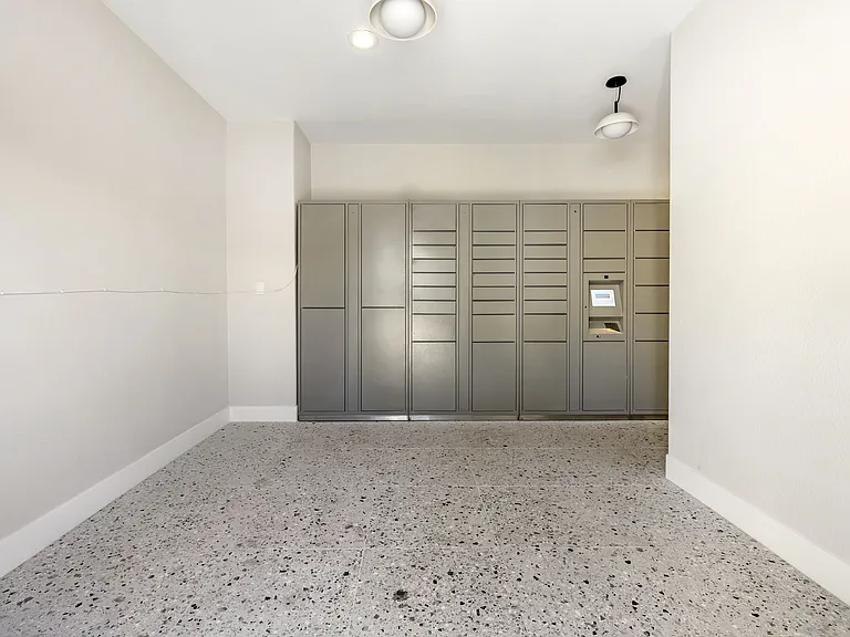Our well-lit and spacious hallway leading to the parcel lockers offers easy, convenient access for all residents.