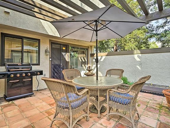 Back patio with grill, seating, and garden