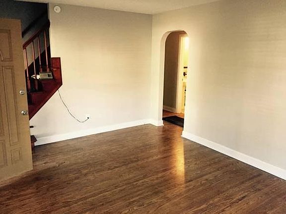 Front Room - Hardwood Floors newly refinished throughout the