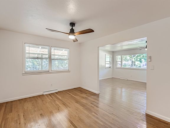 Main floor dining room, newly finished flooring, new lighting and ceiling fan