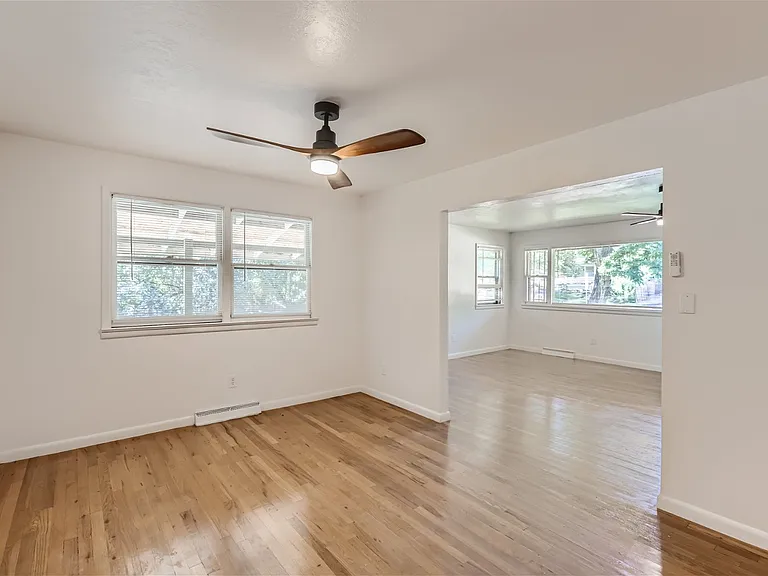 Main floor dining room, newly finished flooring, new lighting and ceiling fan