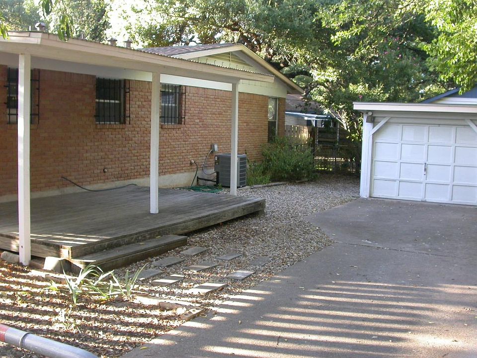 Covered deck, private driveway and detached garage