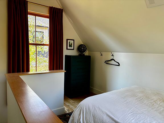 Upstairs bedroom looking toward stairs.