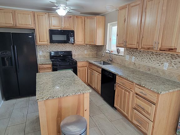 Updated kitchen with granite counters.