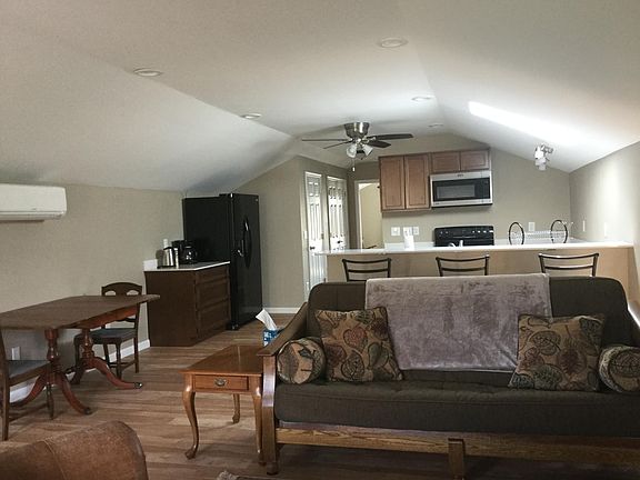 Living/Dining Kitchen area. Eat in Bar as part of Kitchen. Bright Sunlight from skylight makes this apartment an enjoyable retreat.