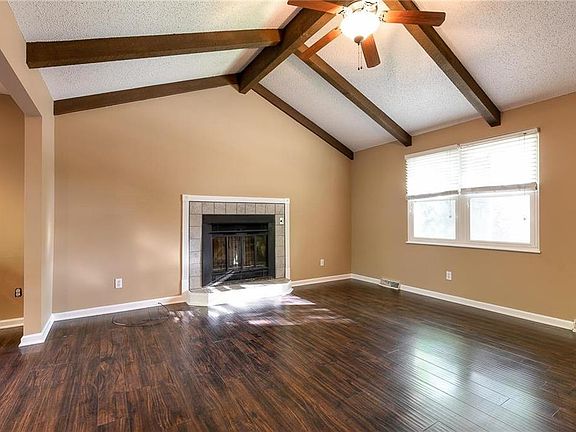 There is an open floor plan with vaulted ceilings and a wood burning fireplace, so cozy on those cold winter nights!