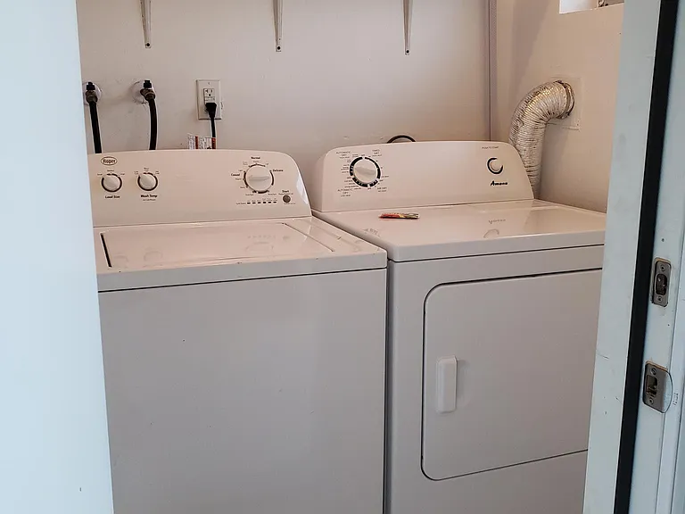 Full size laundry with new appliances in separate room off of back porch.