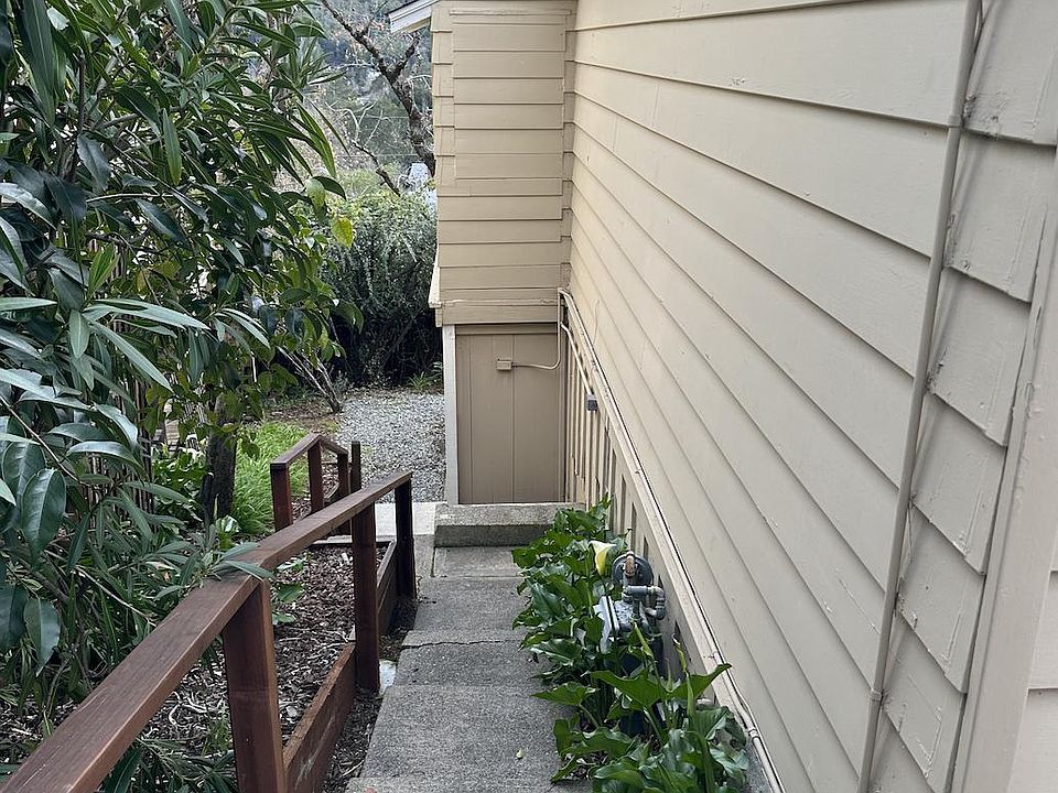 Stairs down to front door from private off-street parking