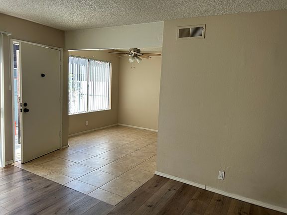 Tile dining area adjacent to the kitchen and living area.