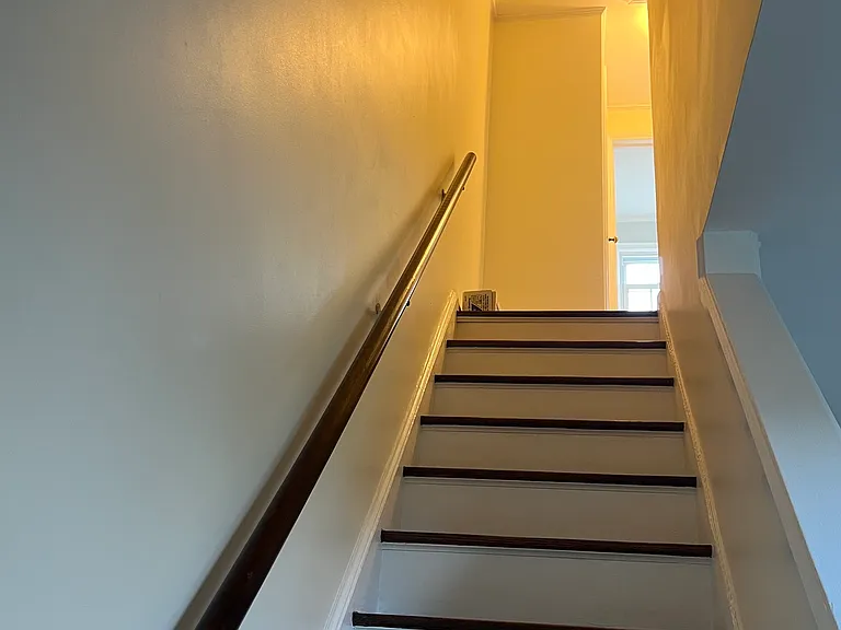 Upstairs to the bedrooms and bath.